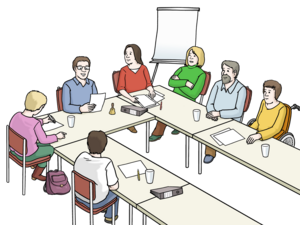 Sitzung mit mehreren Teilnehmenden an einem Tisch in U-Form